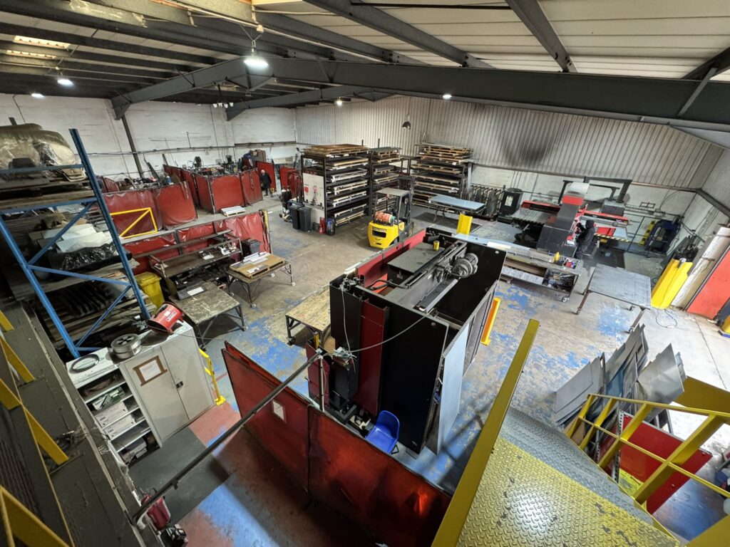Interior of Telford Fabrications' manufacturing workshop showing CNC sheet metal machinery and fabrication facilities.